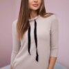 Beige dress with a tie at the neck