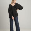 Black oversize blouse with a decorative flower