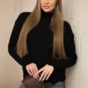 Black sweater with decorative ruffle