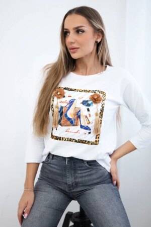 Blouse with 3D graphics and decorative pom pom white