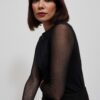 Blouse with transparent sleeves