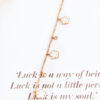 Bracelet on a chain with golden-white flowers