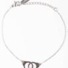 Bracelet on a silver chain decorated with handcuff pendants