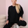 Complete with an oversize blouse in black