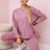 Complete with an oversized blouse in dark pink