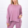 Complete with an oversized blouse in dark pink