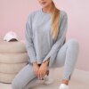 Complete with an oversized blouse in gray color