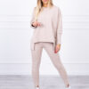 Complete with an oversized blouse in light beige color