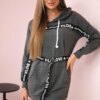 Dress decorated with a graphite slogan tape