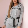 Dress decorated with a tape with gray inscriptions