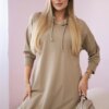 Dress with a hood and a longer rear camel