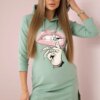 Dress with a longer back and a colorful dark mint print