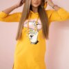 Dress with a longer back and a colorful mustard print