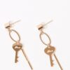 Earrings hanging gold key