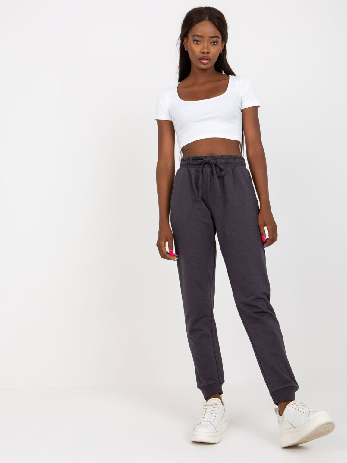 Graphite sweatpants tied at the waist