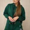 Insulated sweatshirt with dark green press studs