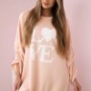 Kesi Włoski Dress with a longer back and print apricot