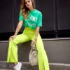 Lady's elegant trousers with slit neon lime
