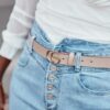 Leather belt with gold buckle of beige color