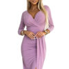 Long shiny dress with a neckline and slit on the legs Numoco