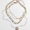 Necklace layered with a coin - gold color