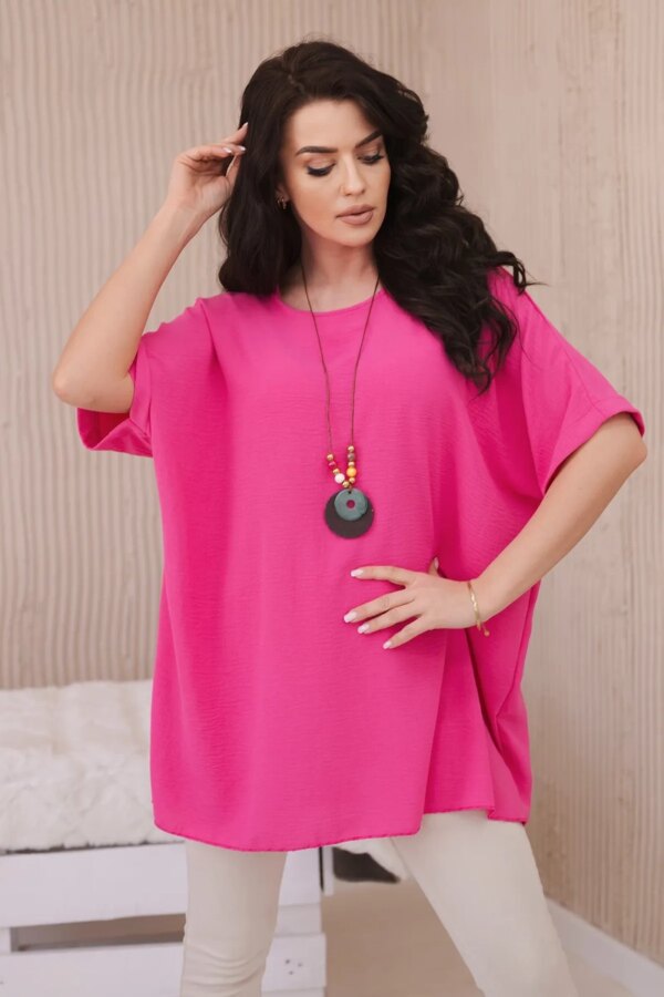 Oversized blouse with a pendant in pink color