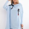 Oversized sweatshirt with asymmetrical sides in cyan color