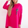 Oversized sweatshirt with asymmetrical sides in fuchsia color