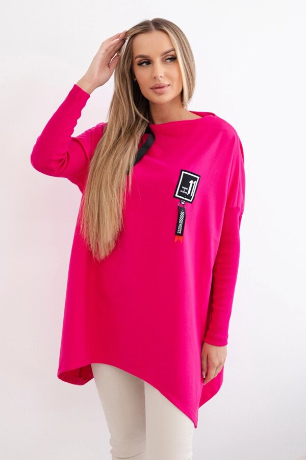 Oversized sweatshirt with asymmetrical sides in fuchsia color
