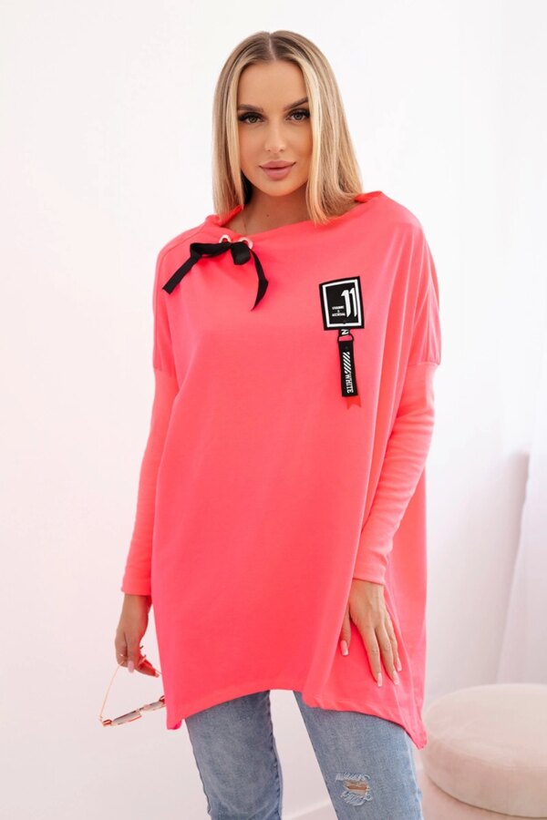 Oversized sweatshirt with asymmetrical sides in pink neon color