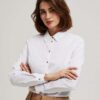 Plain shirt with decorative buttons