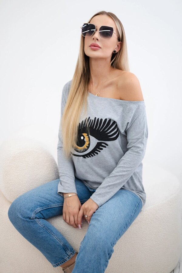 Printed blouse with a longer back in grey