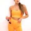 Set of high-waisted trousers in orange neon colour