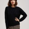 Sweater with decorative fabric