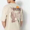 Trendyol Bézs Oversize/Wide-Fit Tropical Arizona City mintás 100% pamut póló