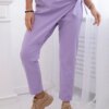 Trousers tied with an asymmetrical light purple front