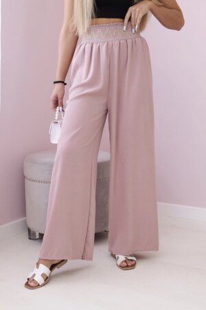 Trousers with a wide elastic waistband in dark pink colour