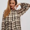 dress with a patterned print and a ruffle