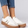 marka niezdefiniowana White women's sneakers with gold accents Melly